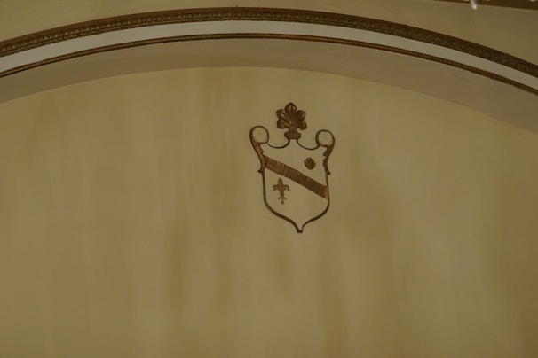 Elegant crest of the Noble Order of the Fleur de Lis displayed on a classic parchment background.