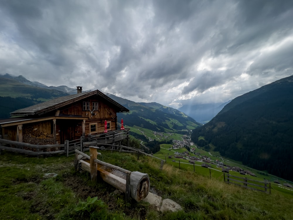 a wooden house on a hill