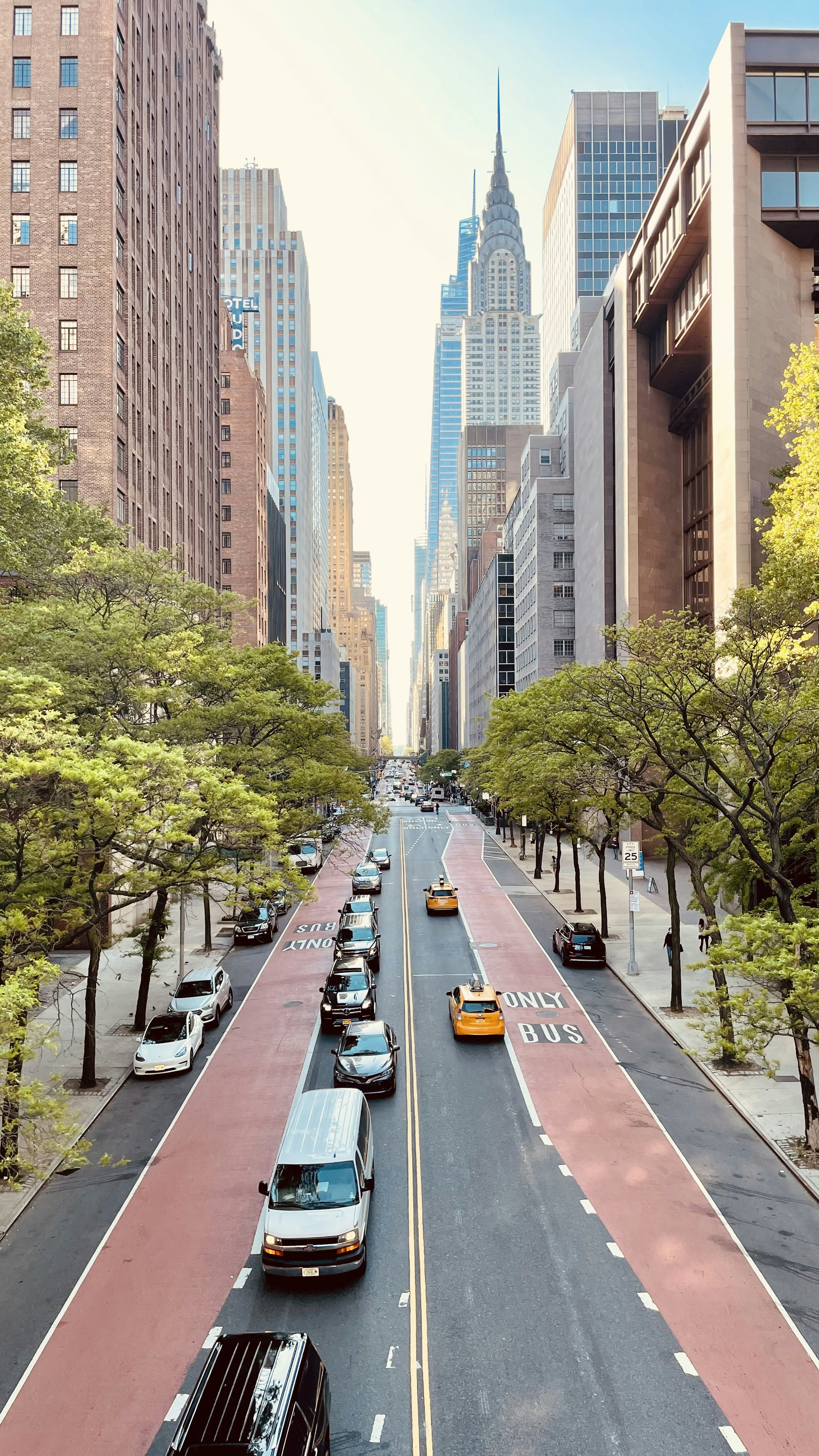 a street with cars and buildings on either side of it