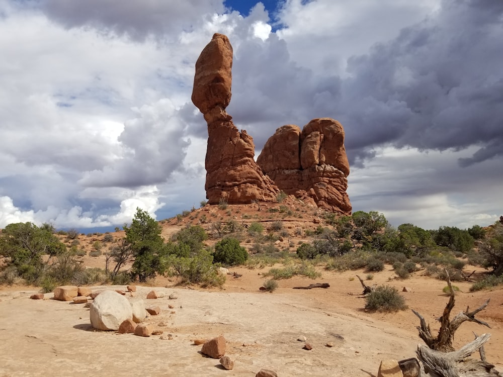 a desert landscape with a rock formation