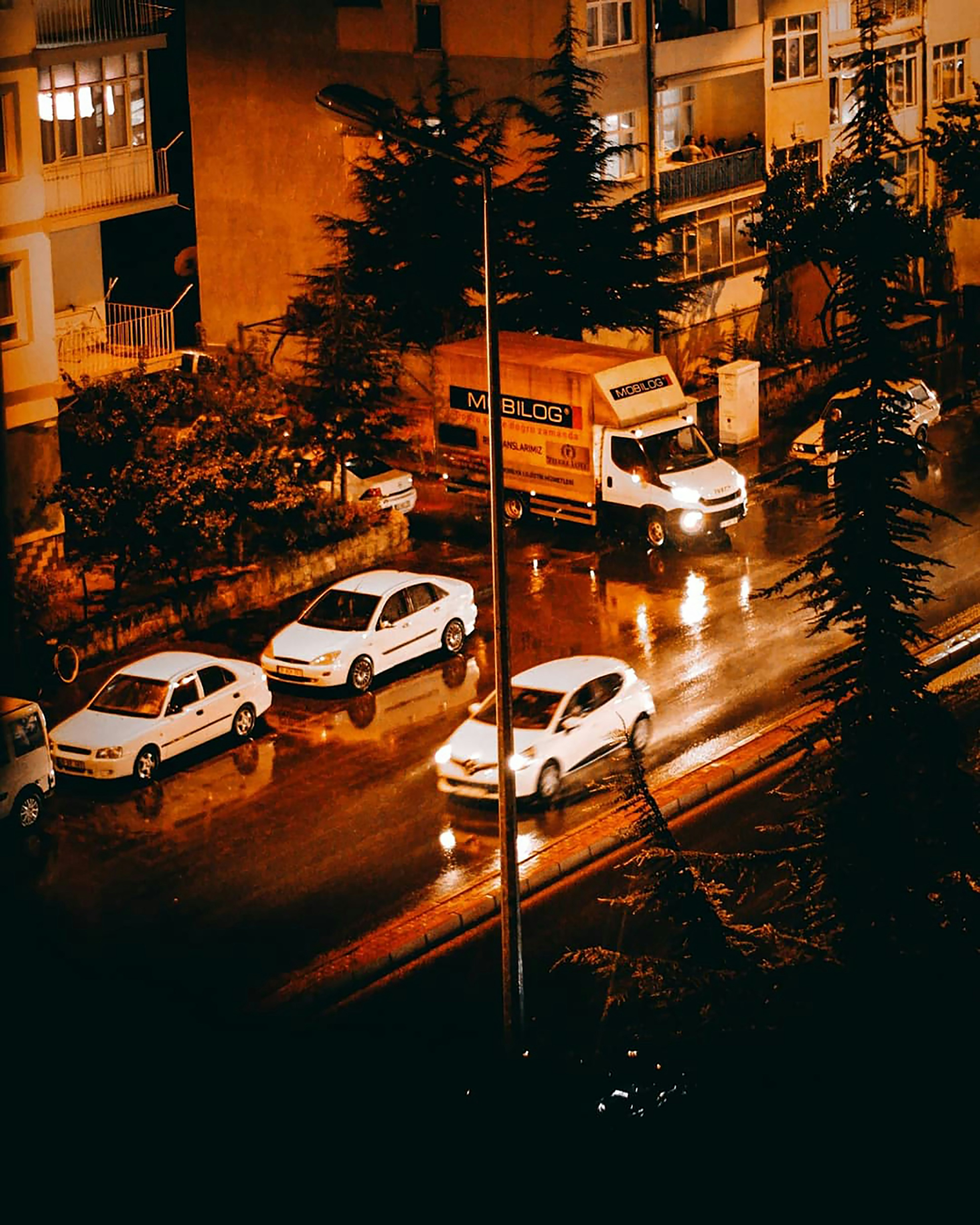 a group of cars parked on the side of a street