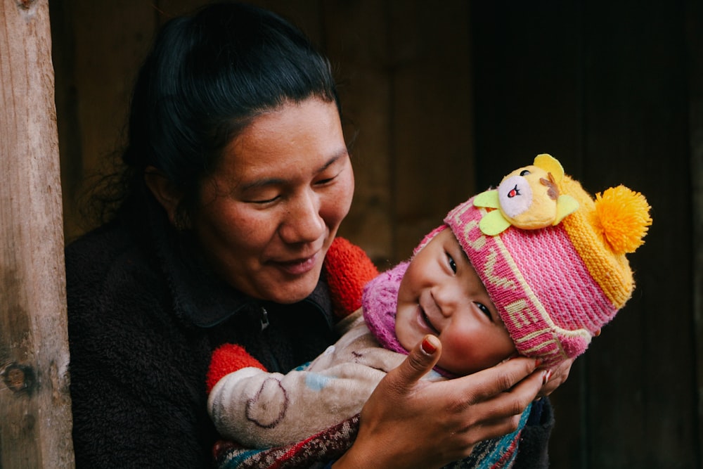 a person holding a baby