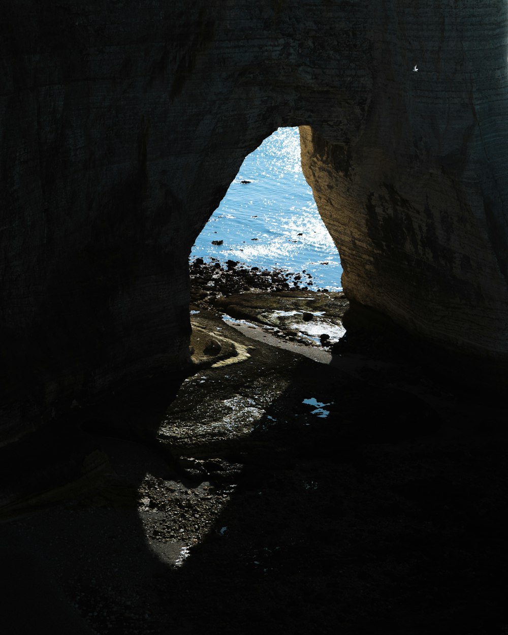 a cave with a light at the end