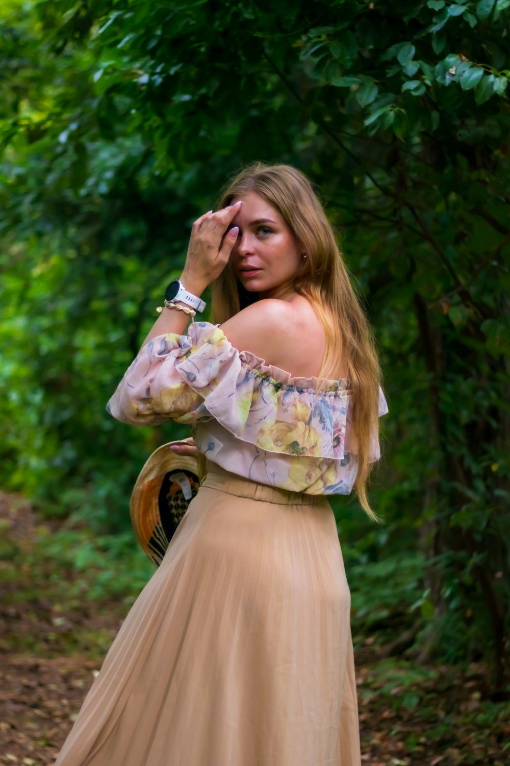 a person in a dress holding flowers