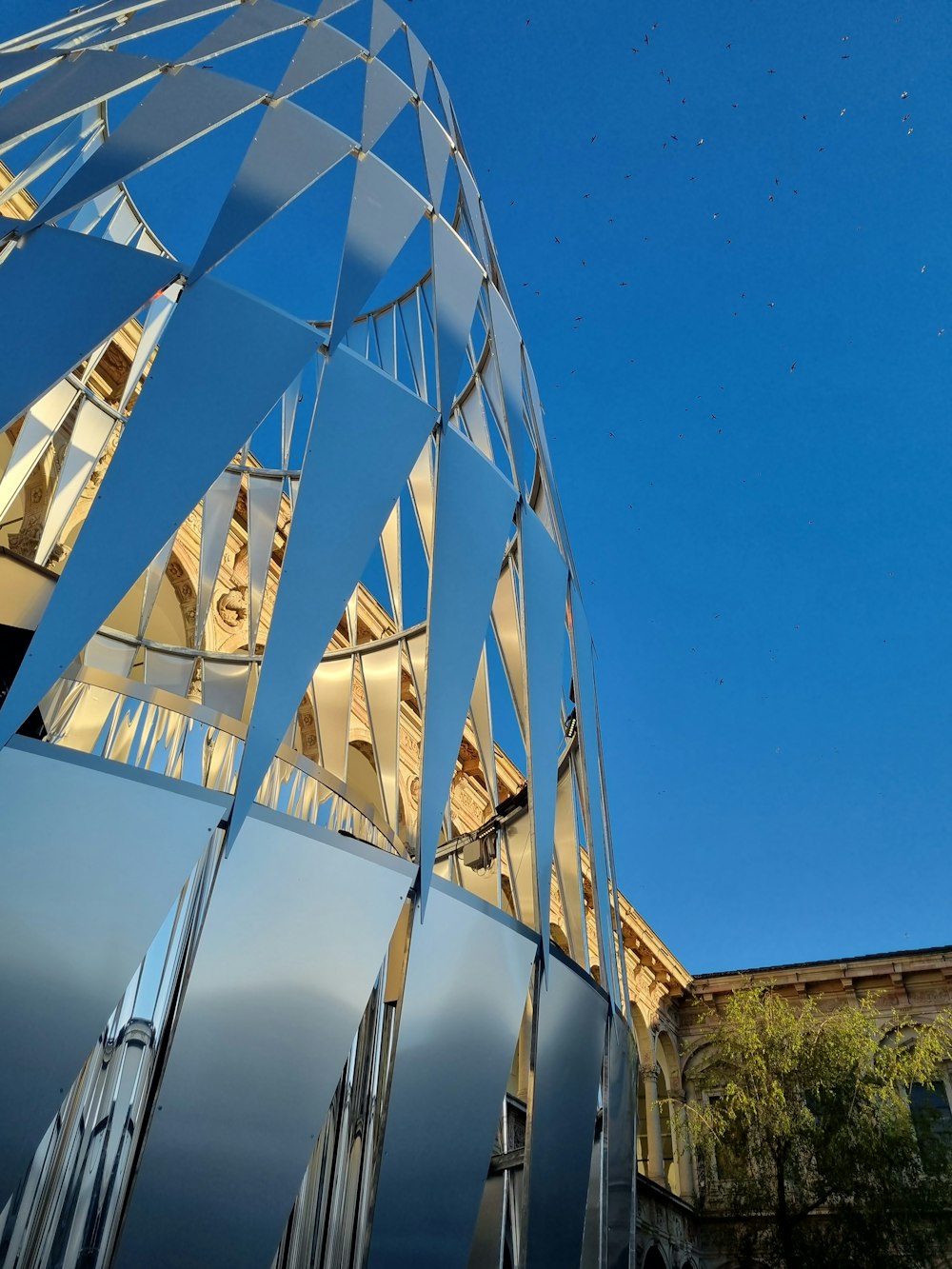 a tall building with a glass front