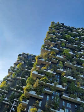 Green residential architecture with planted balconies representing sustainable luxury positioning.