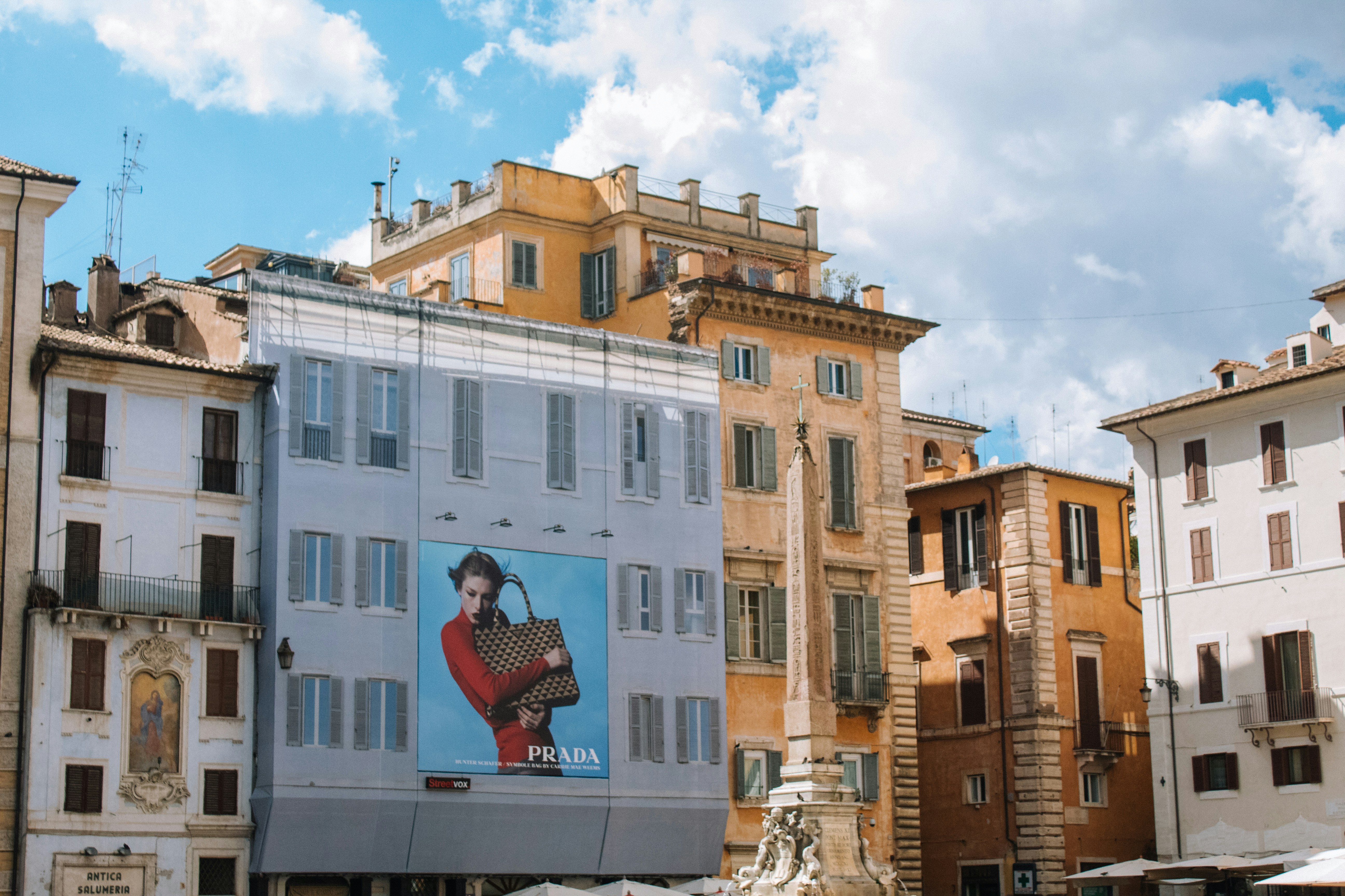 a group of buildings with a painting on the side