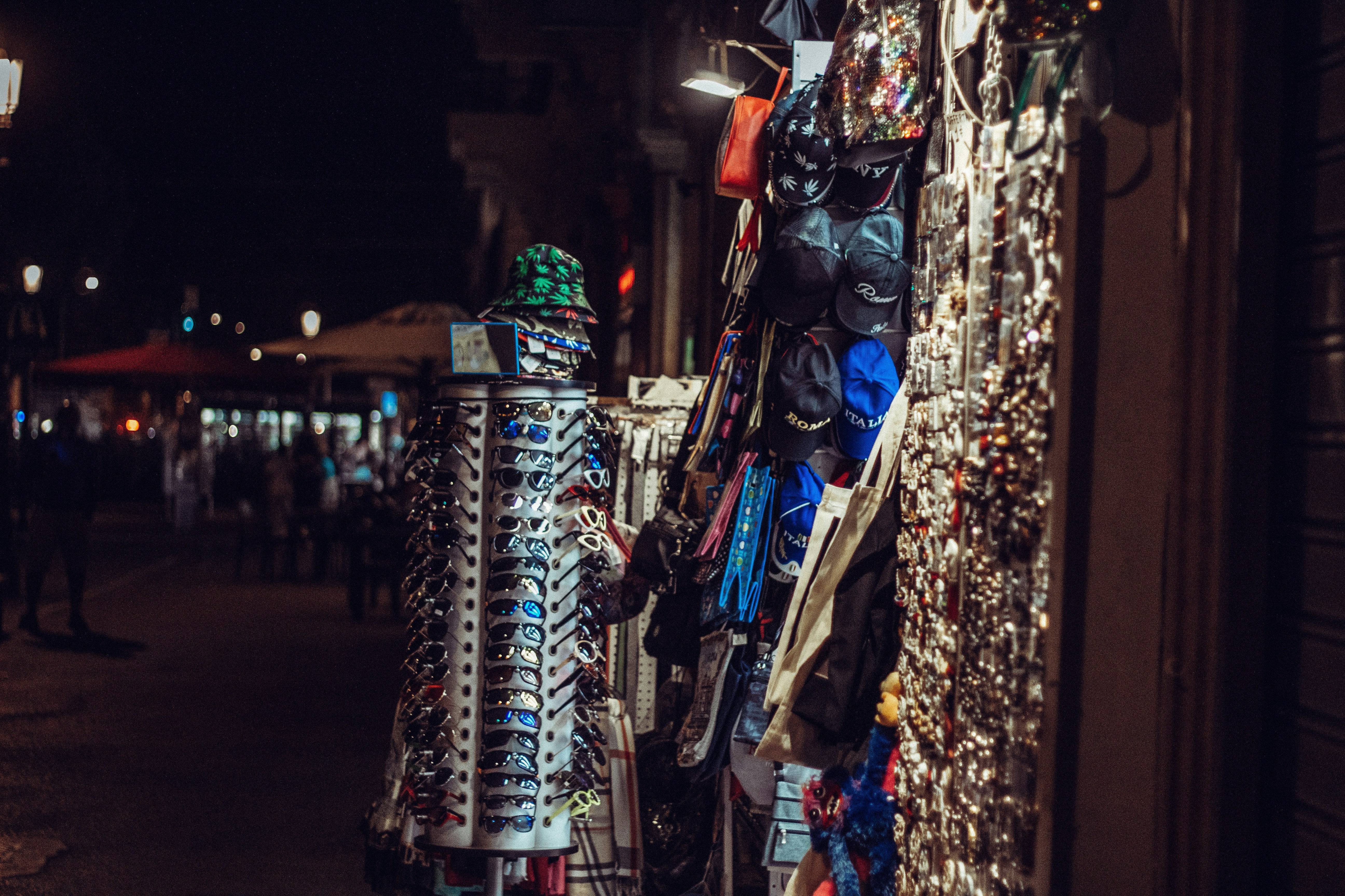 a group of people walking down a sidewalk