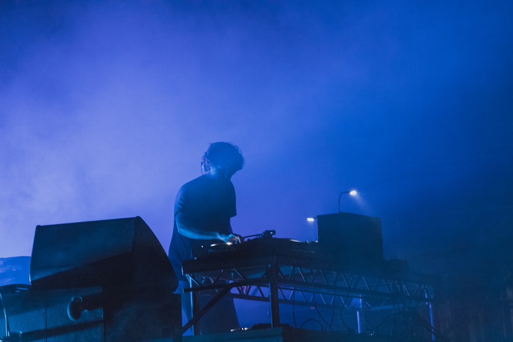 a person playing a keyboard on a stage