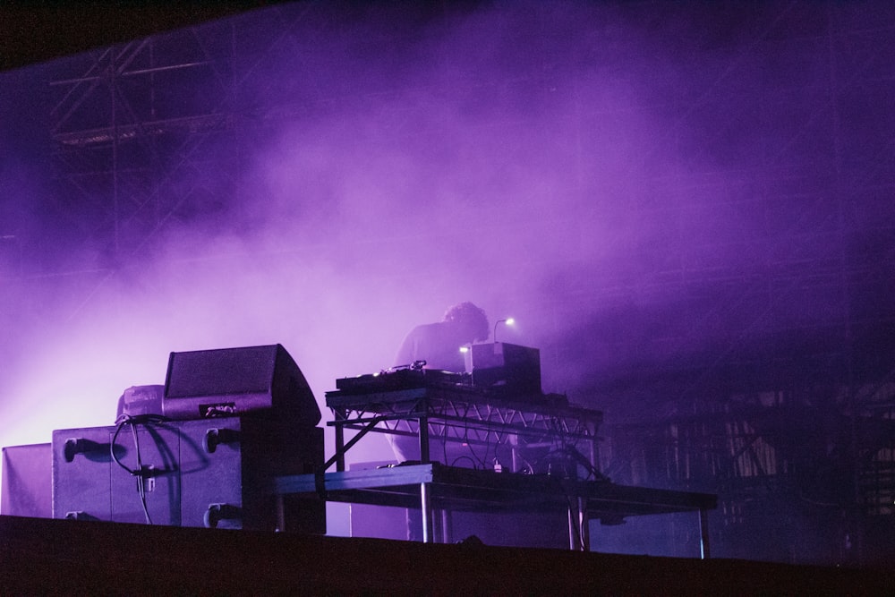 a factory with a purple sky