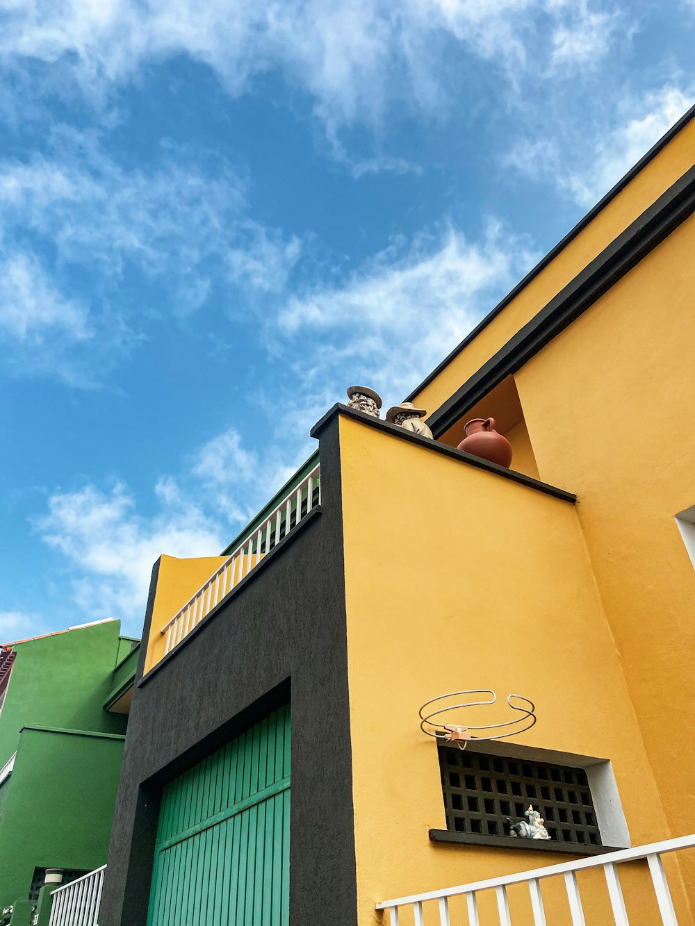 a yellow building with a blue sky