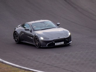 A sleek sports car speeding down a winding road.