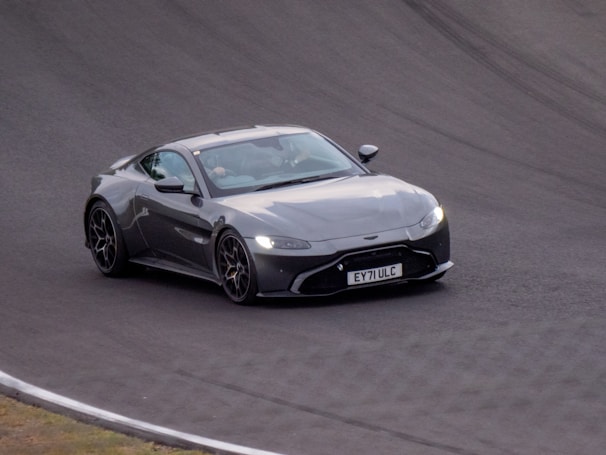 A sleek sports car speeding down a winding road.