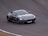 A sleek sports car racing on a winding road, showcasing speed and excitement.