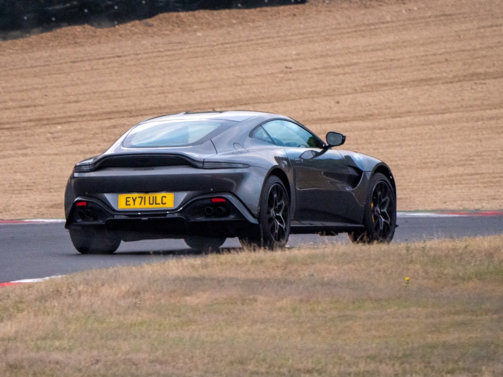 a black sports car on a road