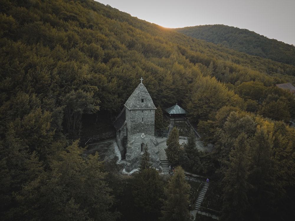 a stone building on a hill