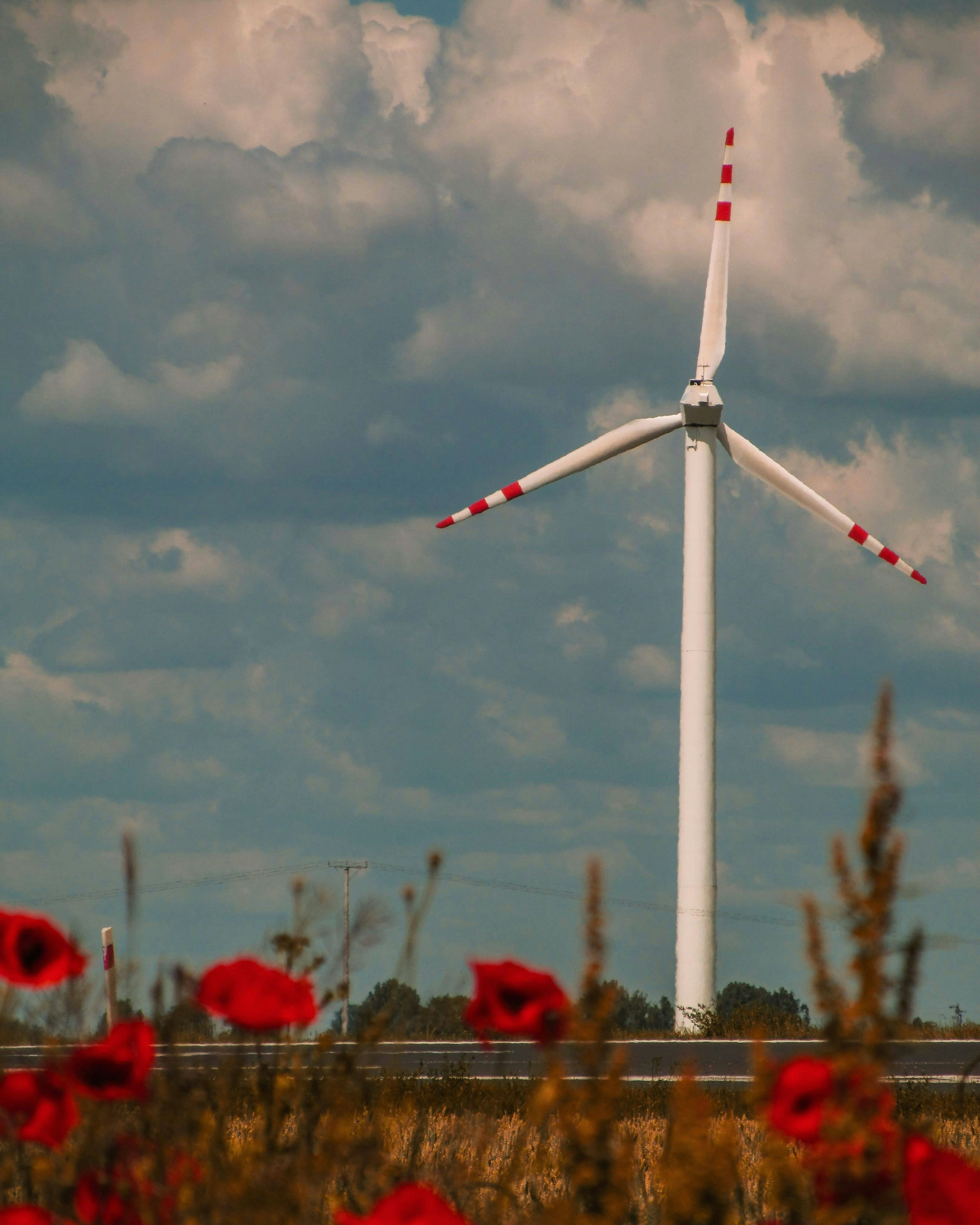 a windmill with a cloudy sky
