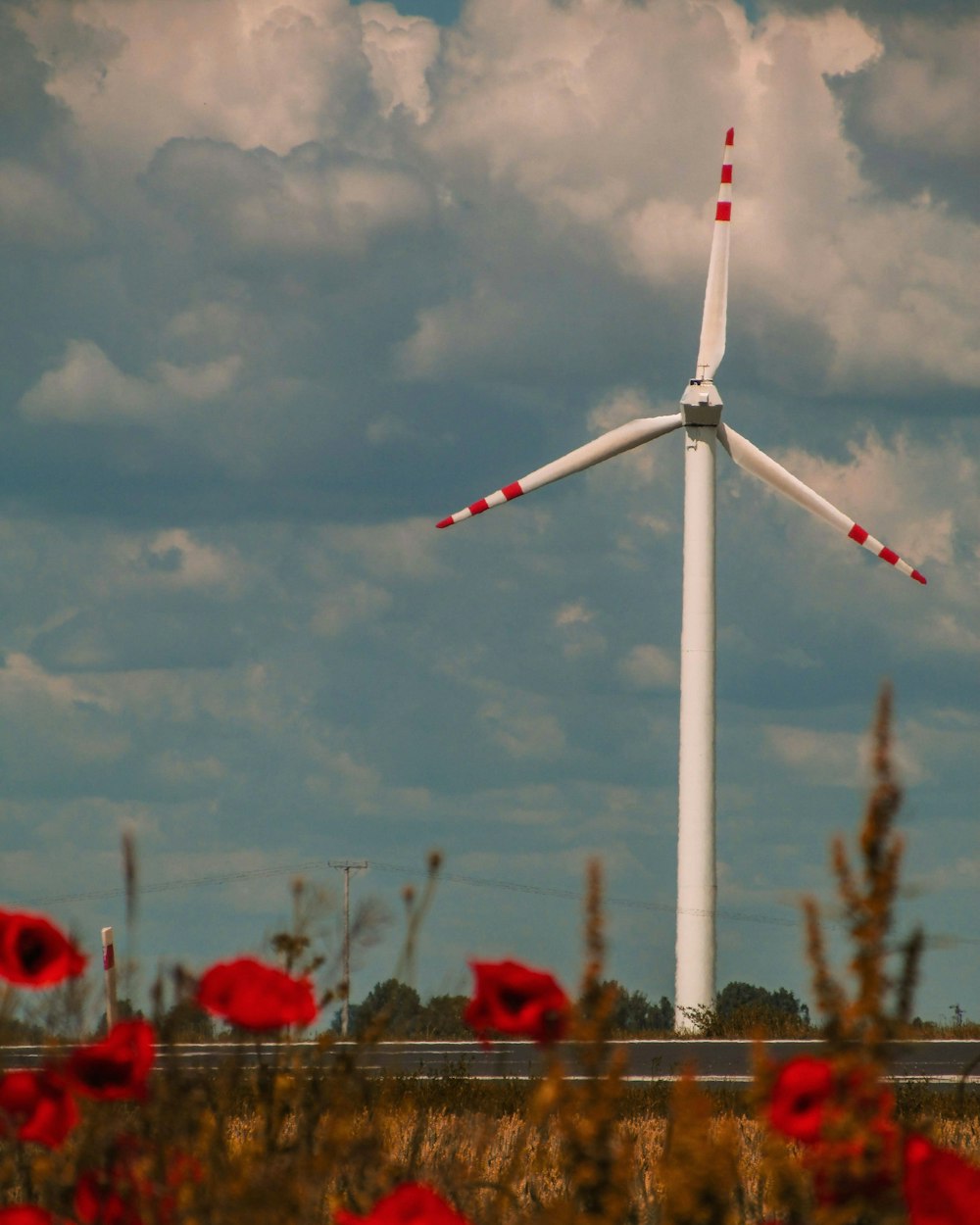 a windmill with a cloudy sky