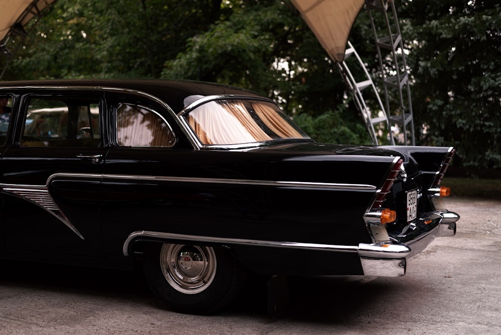 a black car with a crane on top of it