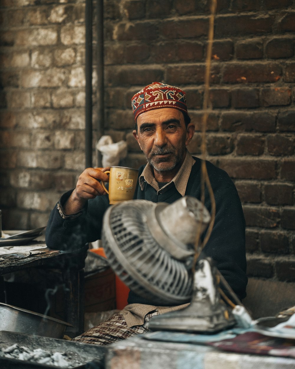 a man holding a glass of beer