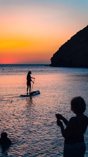 a person on a surfboard in the water