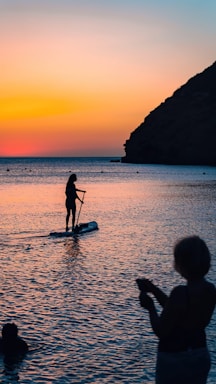 a person on a surfboard in the water