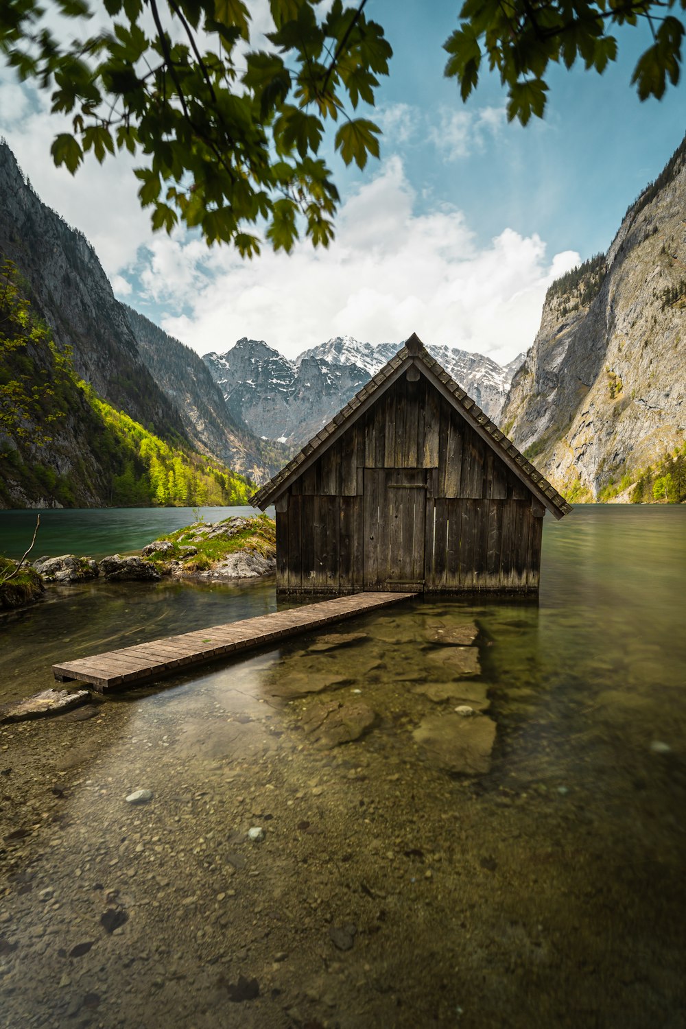 a wooden shack in a lake