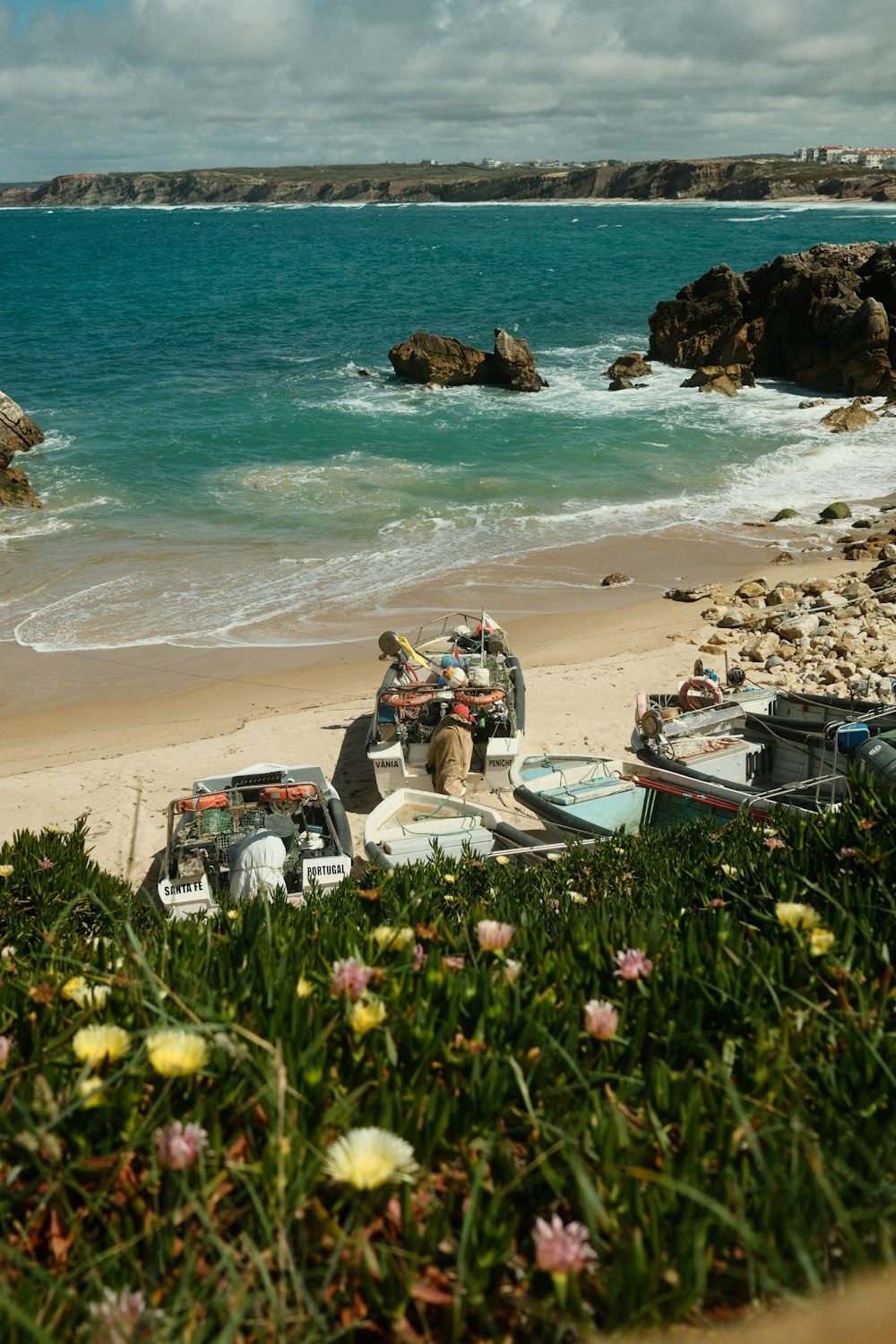 a group of boats on a beach