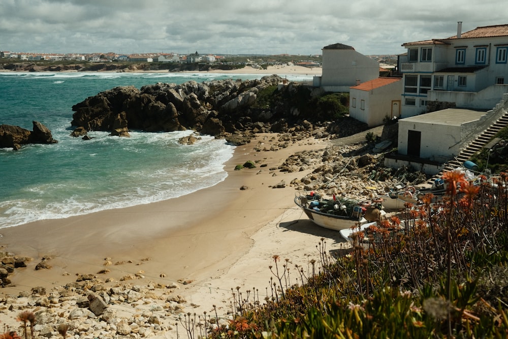 a beach with houses and a body of water