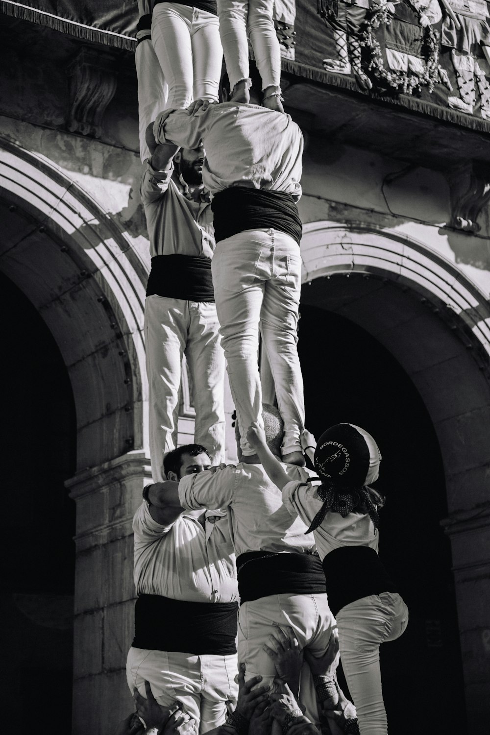 a group of people climbing a building