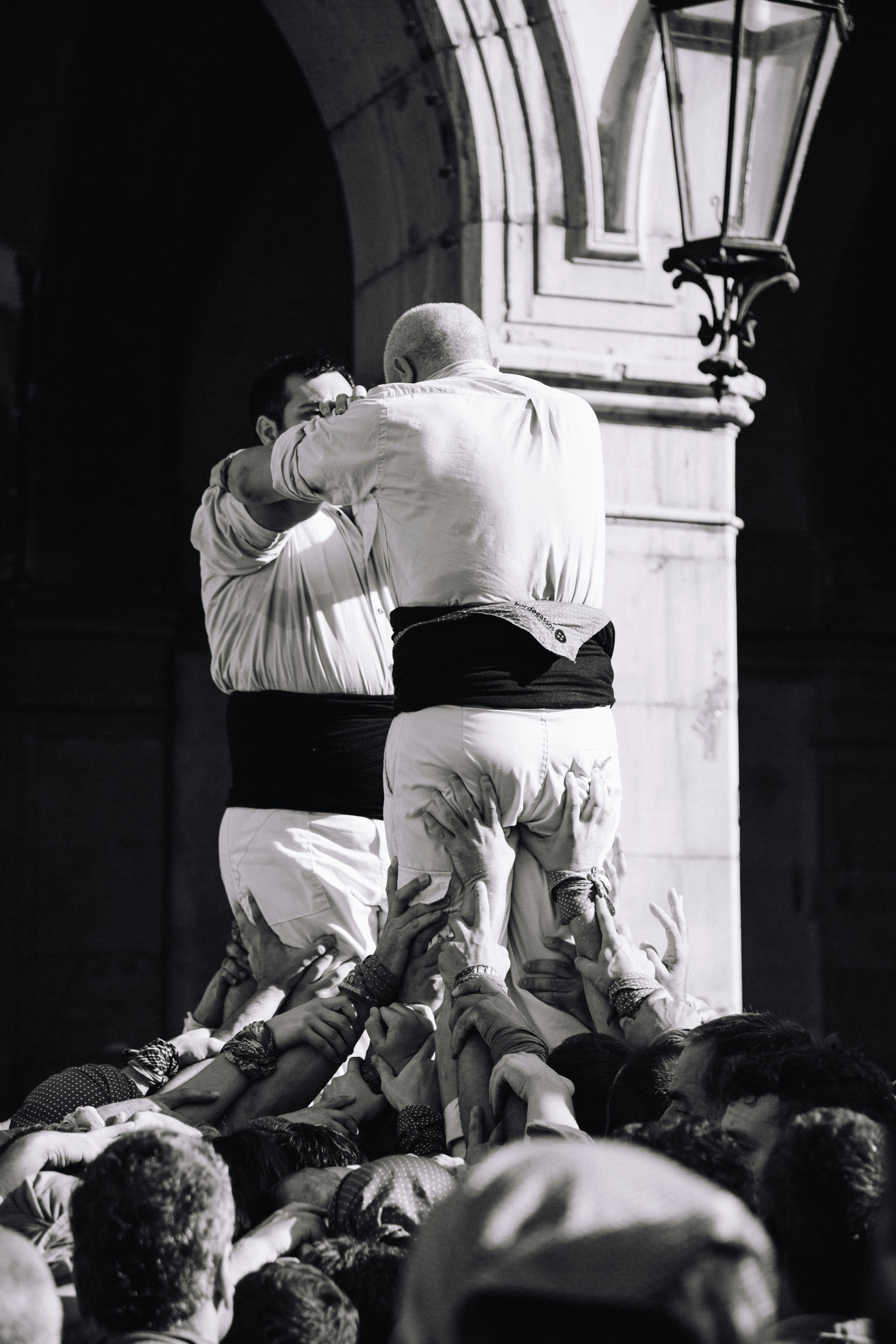 a man standing on a man's back