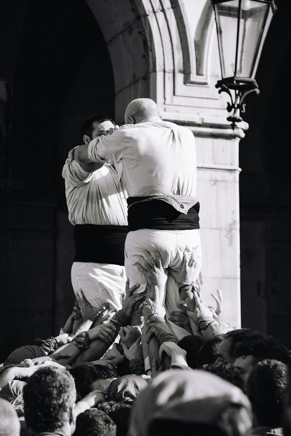 a man standing on a man's back