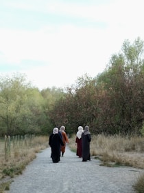 a group of people standing on a road