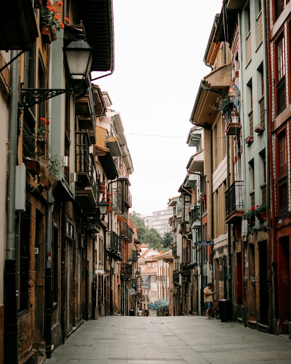 a narrow street with buildings on both sides