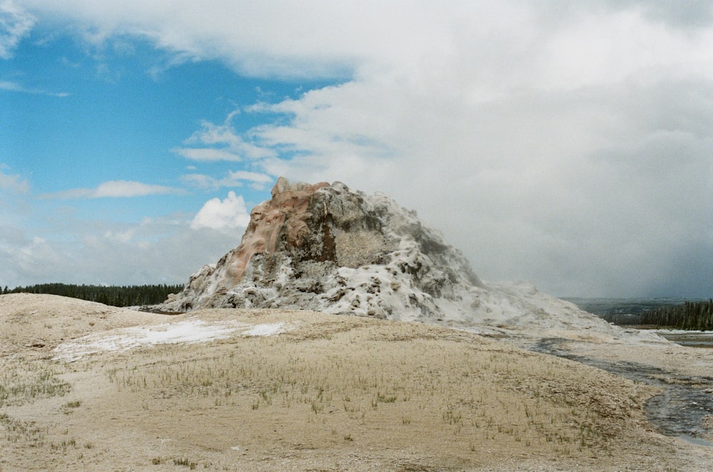 a rocky mountain with snow