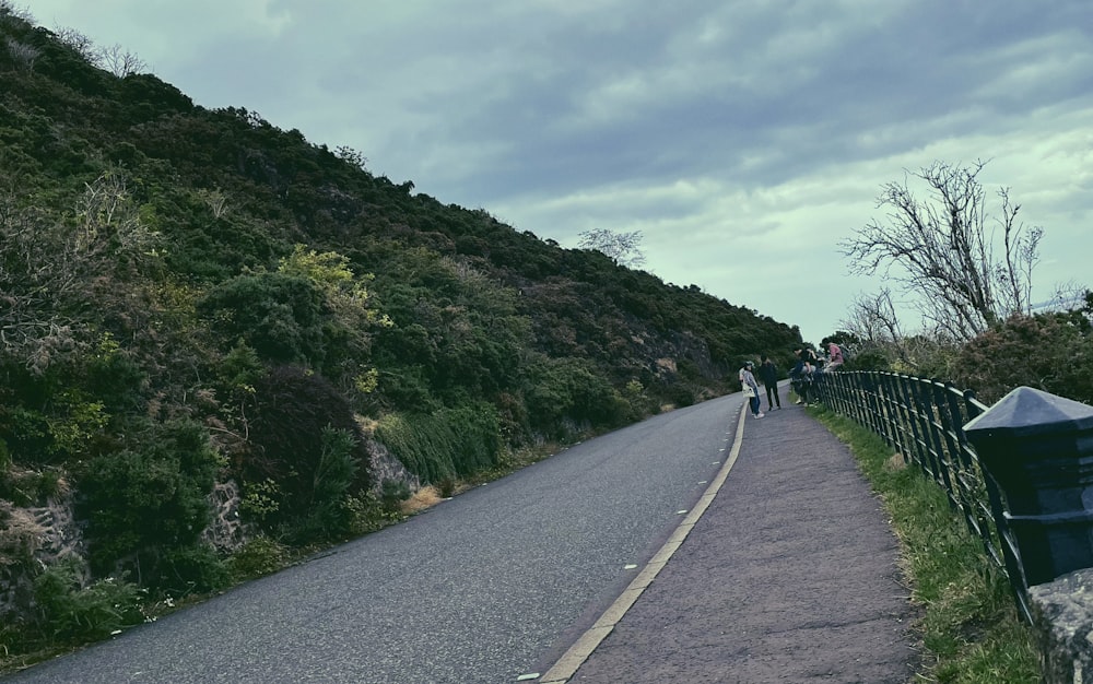 people walking on a road