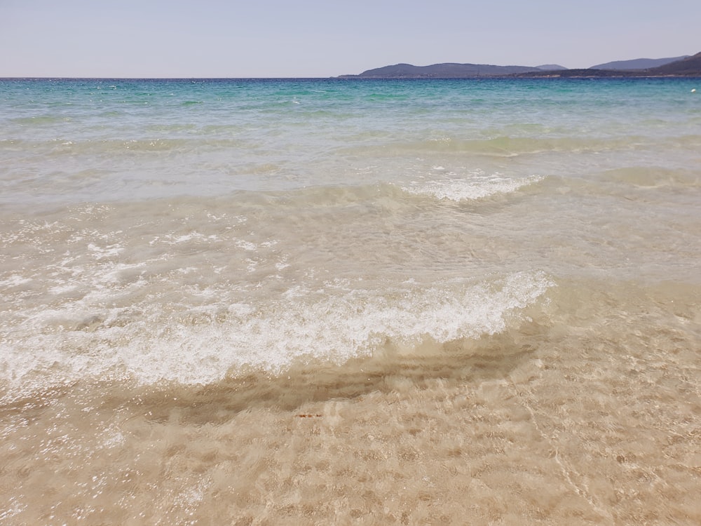 a body of water with waves