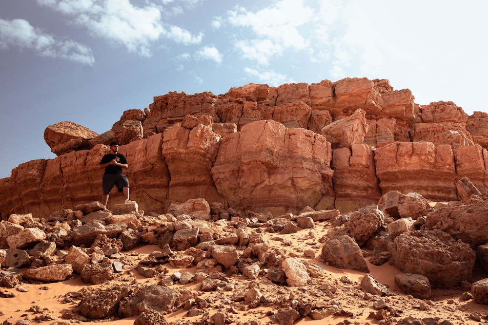 a person standing on a rock