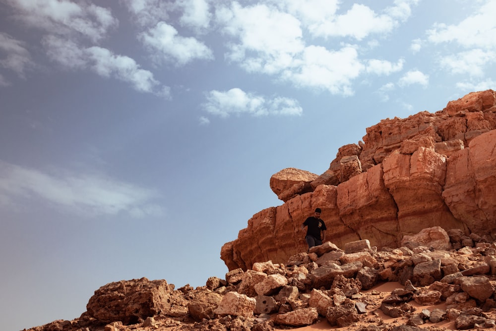 a person standing on a rock