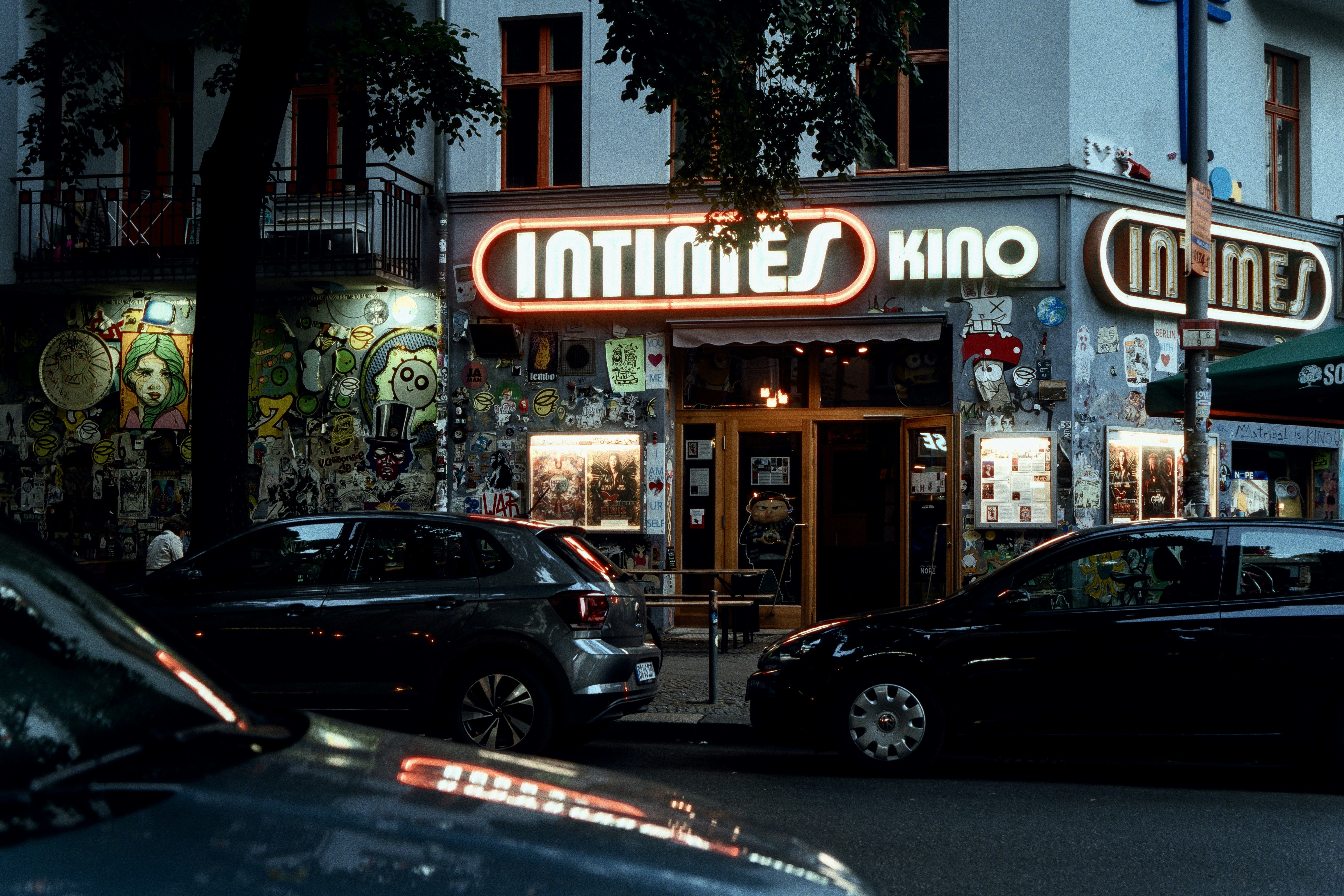 a street with cars and buildings