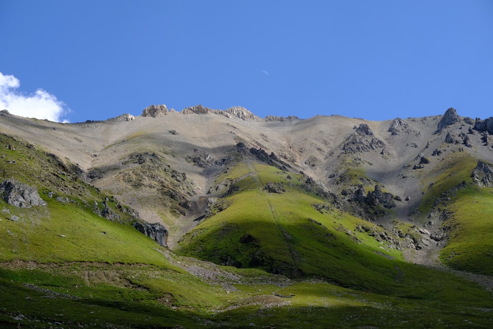 a mountain with a valley below