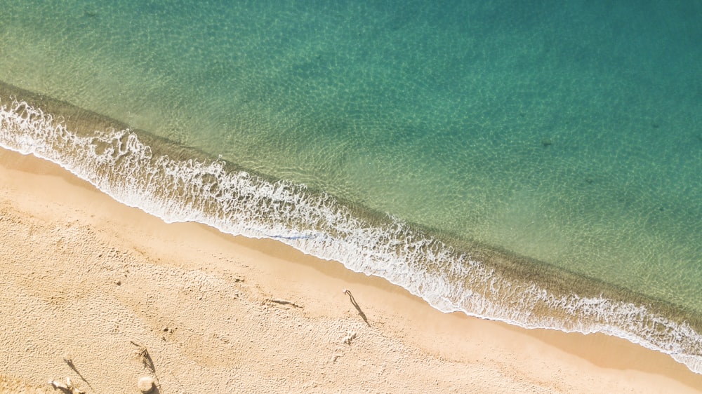 a sandy beach with waves