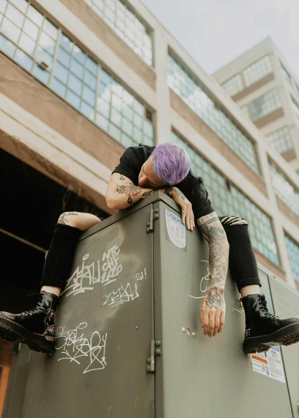 a person climbing on a metal box