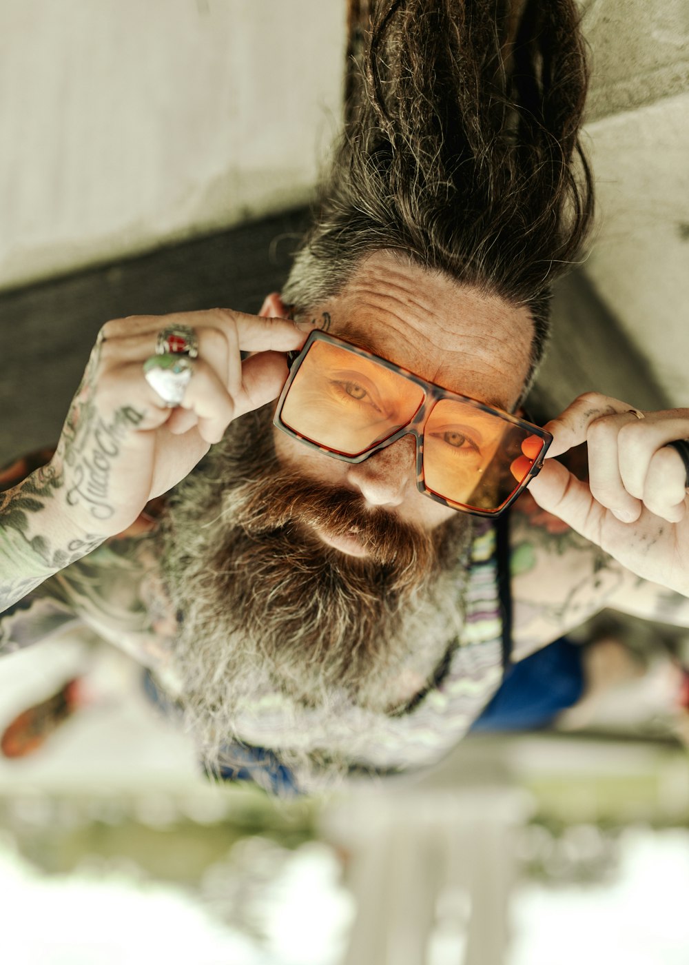 a man with a beard and glasses