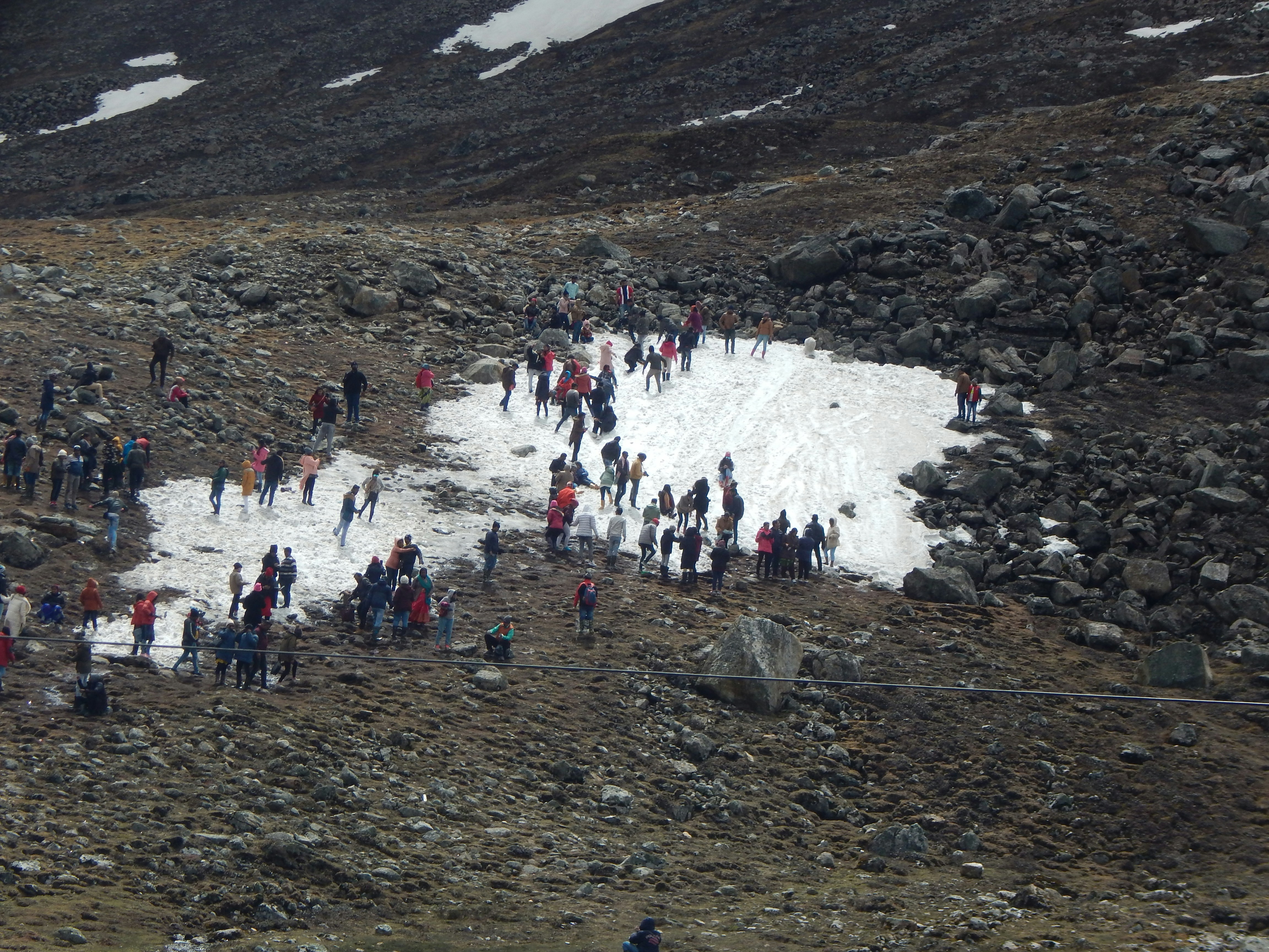 a group of people on a rocky mountain