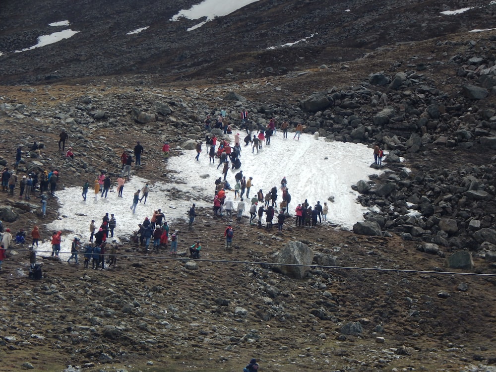 a group of people on a rocky mountain