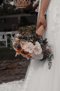 a person holding a bouquet of flowers