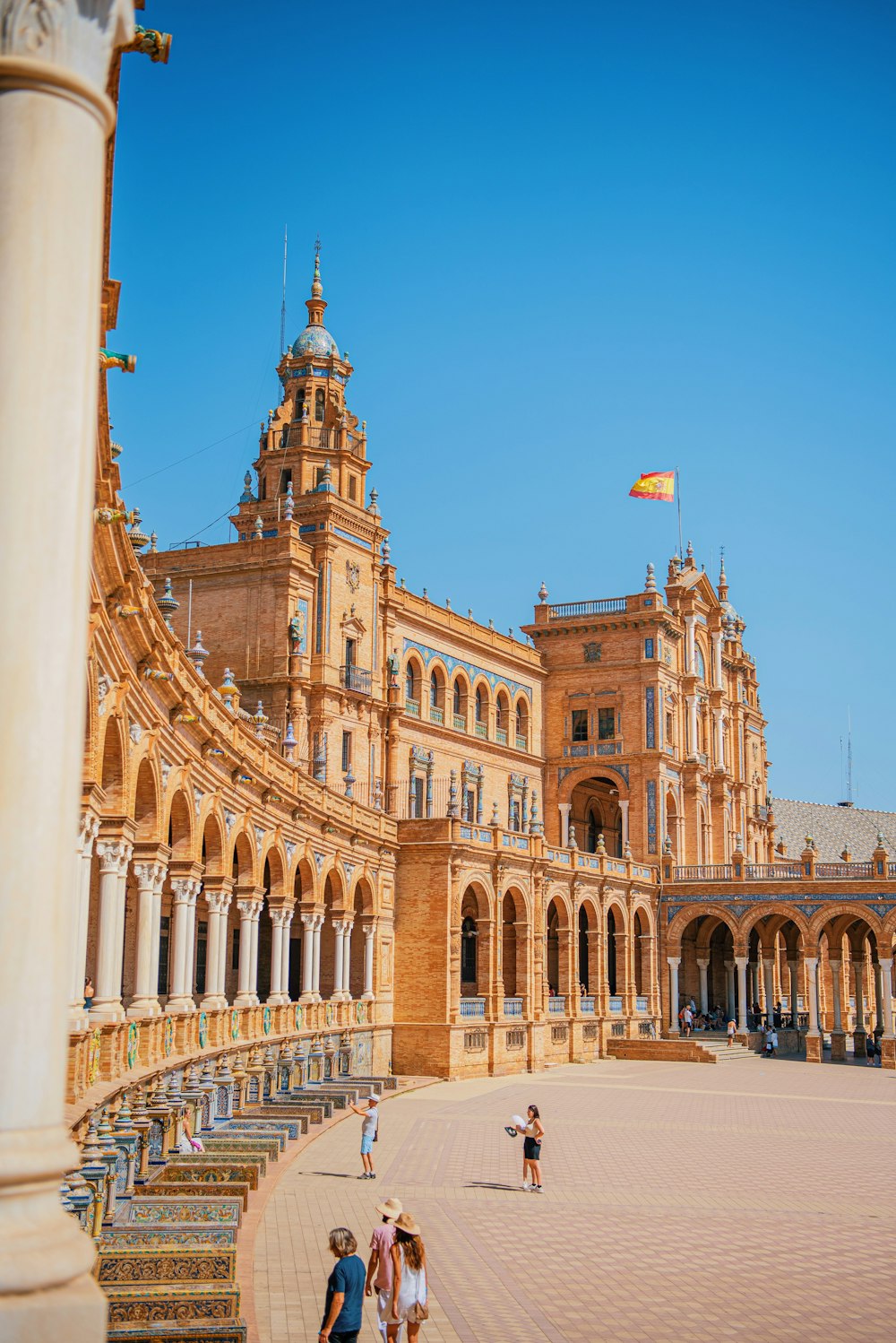 a large building with a flag on top