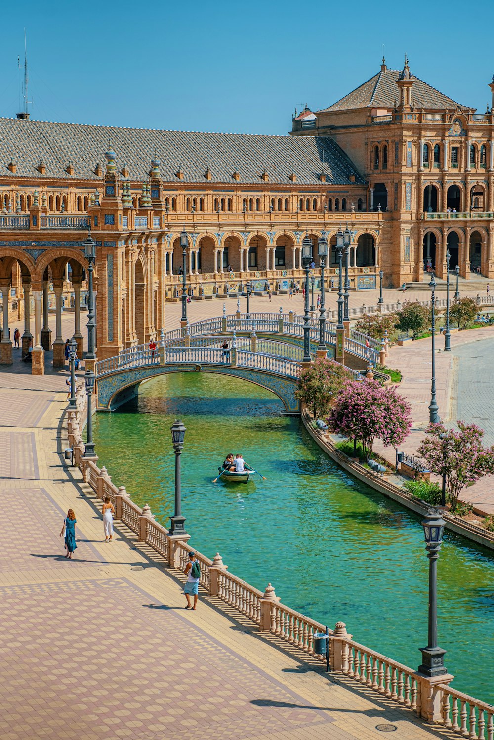 a canal with a boat and buildings