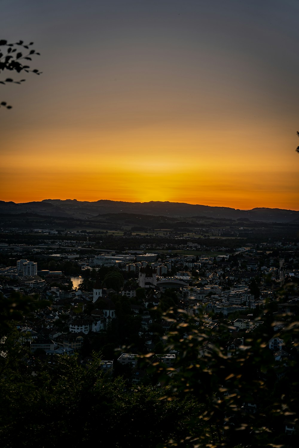 a city with a sunset in the background